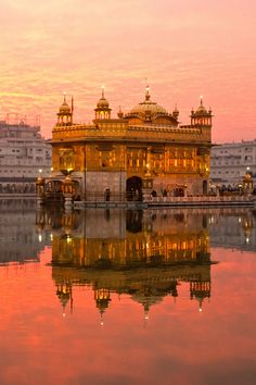 a large building sitting on top of a body of water