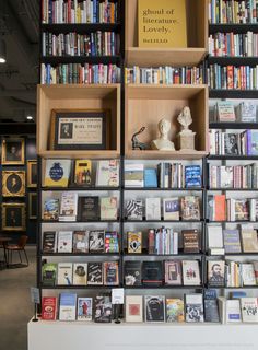 the bookshelves are filled with many different types of books