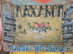 there is a sign that says maxano and has fruit in the bottom right hand corner