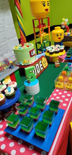 a lego themed birthday party with cupcakes and cake