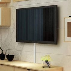 a flat screen tv mounted to the side of a wall