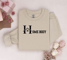 Homebody Sweatshirt | Homebody Sweater | Introvert Gift | Women's Crewneck Homebody Sweater | Cozy & Cute Sweatshirt | Homebody Hoodie Embrace your cozy side with our Homebody Sweatshirt, perfect for those who love staying in! This soft and stylish Homebody Sweatshirt is a must-have for any introvert who enjoys comfort and relaxation. Available in various colors, this women's crewneck sweater is perfect for lounging at home or casual outings. A thoughtful gift idea for introverts, homebodies, or Gifts For Homebodies, Homebody Sweatshirt, Gift Ideas Women, Homebody Club, Comfy Sweater, Club Sweatshirts, Cozy Fabric, Cozy Socks, Cute Sweatshirts