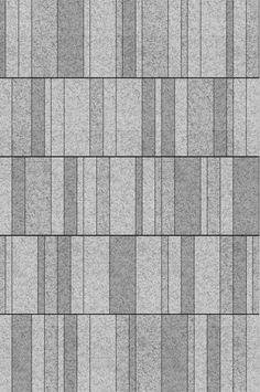 a gray brick wall texture that is seamed into squares and rectangles to create an interesting pattern