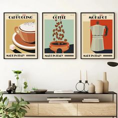 three coffee posters are hanging on the wall above a table with a vase and potted plant