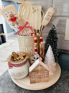 a kitchen counter with christmas themed utensils and cookie cutters in a cup