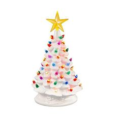 a white ceramic christmas tree with multicolored lights and a gold star on top