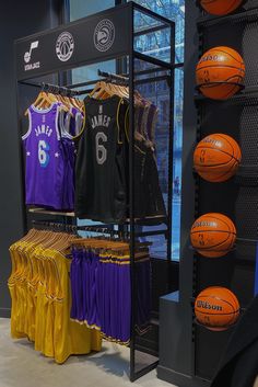 basketballs and jerseys are on display in the store