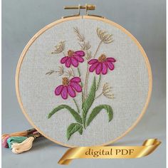 the embroidery pattern has pink flowers on it