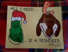 a christmas card with an image of a reindeer and a dog wearing a santa hat