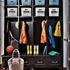 an organized closet with shoes, umbrellas and other items on it's shelves