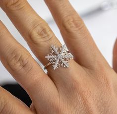 Welcome winter with our whimsical holiday snowflake ring, Crystal. It features 100% simulated diamond material (AAA CZ) stones on each of the 6 arms, adding sparkle to your whole look. It is about 3/4" in size. The intricate design of the certified 925 sterling silver band is plated in rhodium.  Buy this intricate ring design for the holidays and enjoy a festive and fun look, that can carry on throughout the winter season! Snowflake Diamond Ring, Diamond White Snowflake Jewelry For Formal Occasions, Formal Snowflake Diamond White Jewelry, Christmas Anniversary Jewelry With Cubic Zirconia, Cubic Zirconia Jewelry For Christmas Anniversary, Christmas Anniversary Cubic Zirconia Jewelry, Formal Diamond Snowflake Jewelry, Formal Snowflake Diamond Jewelry, Formal Christmas Snowflake Jewelry