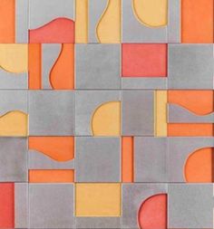 an abstract tile design with orange and grey squares