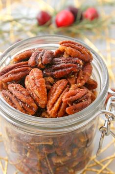 a glass jar filled with nuts on top of a table