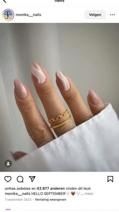 a woman's hand with pink nail polish and gold ring on it, showing her nails