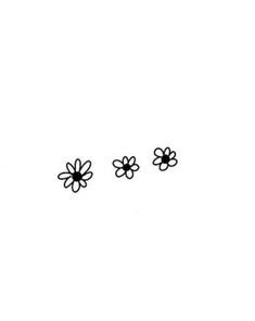 three small black flowers on a white background