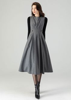 "★★ Welcome to my Ylistyle shop！！！ This beautiful gray wool pinafore dress is made from the high quality wool fabric. Comfortable fit, elegant, and feminine look. Perfect for everyday or special occasions. Perfect to wear on colder days with your favorite turtleneck, boots, and matching jacket. ★★FEATURES Wool blend fabric (25% wool, other fiber,nylon) Polyester lining Round neckline Sleeveless Midi length Back zipper closure With pockets Perfect for winter, spring, autumn ★★ The model's height Pinafore Dress Outfit Winter, Winter Dress Casual, Wool Pinafore, Pinafore Dress Outfit, Grey Midi Dress, Dress Pleated, Dress Winter, Handmade Dress, Dress Handmade