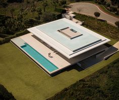 an aerial view of a house with a swimming pool