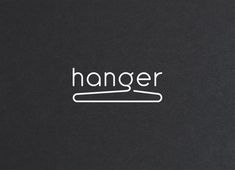 the word hanger is written in white on a black background with a wooden stick