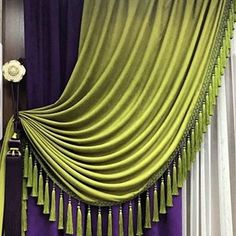 a curtain with tassels hanging from it