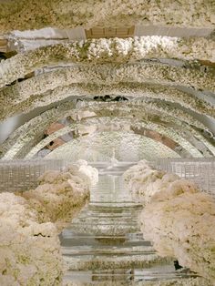 the ceiling is covered in white flowers