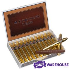 an open box of chocolate cigars in gold foil