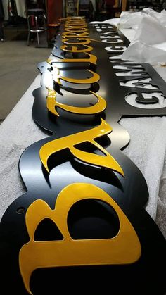 several black and yellow signs sitting on top of a table