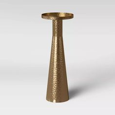 a gold pedestal with a circular base on the top is shown in this 3d image