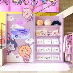 a display case in a store filled with cartoon characters and other things on it's shelves