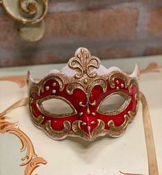 Original Venetian mask handmade in carâché and hand painted in acrylic colors and gold/silver leaf.Beautiful to wear on some particular occasion but also as a decoration of the house.All our masks are handmade by our staff (me, my wife and our collaborators) in our atelier in Venice. The masks are all made of paperweight and are made using ancient techniques from the 1300sThey are decorated with acrylic colors, gold leaf, silver leaf, trifies, lace and Swarovski crystals so as to make them more Red Mask Masquerade, Red Masquerade Mask, Glitter Mask, Beautiful Masks, Gold Masquerade Mask, Mask Carnival, Venice Mask, Venetian Masquerade Masks, Ancient Techniques