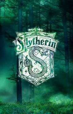 slytherin logo in the middle of a forest