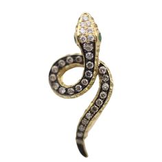 A sleek and stylish snake set with diamonds, sapphires and tsavorites! A small pin that can be worn easily on any outfit. It features 0.35 carats of round brilliant-cut diamonds along with 0.68 carats of yellow sapphires and two tsavorite eyes. The pendant is made in 18k yellow gold and has rhodium plating running down the snake giving the piece great contrast of color. Length: 1 inch Weight: 3.4 grams Snake Rings, Snake Pendant, Small Pin, Snake Ring, Gold Snake, The Snake, Diamond Gold, Yellow Sapphire, Round Brilliant Cut Diamond