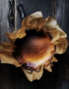 a baked pastry sitting on top of a wooden table