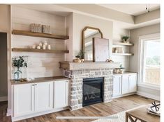 a living room filled with furniture and a fire place