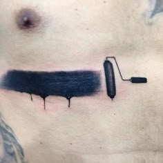 a man's chest with a knife and ink dripping from it on his stomach