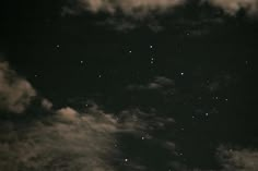 the night sky is filled with stars and clouds