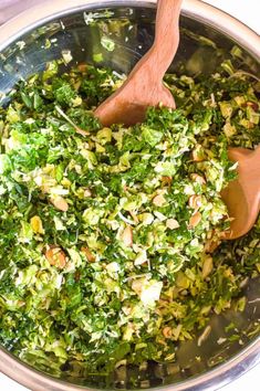 a wooden spoon in a pot filled with chopped vegetables