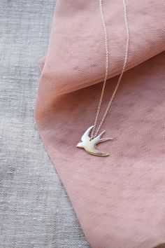 This sterling silver swallow necklace is a beautiful & feminine must have piece!Oh so pretty!— d e t a i l s —-swallow pendant measures 2.5 x 2.5cm-hand sawn from sterling silver-completed in a mirror finish-includes a 45cm silver chain-All Lola&Cash jewellery will arrive in gift giving mode>>>——��————————<<<>>>——————————<< Sterling Silver Bird Necklace, Silver Bird-shaped Sterling Silver Necklace, Elegant Silver Necklace With Bird Shape, Elegant Sterling Silver Necklace With Bird Design, Swallow Jewelry, Swallow Necklace, Tarnished Silver, Bird Necklace, Bird Jewelry