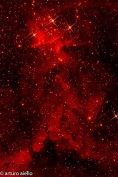 an image of some red stars in the sky