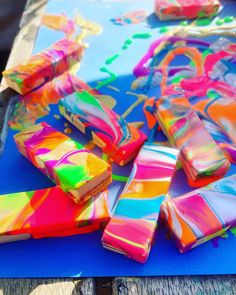 colorful candy bars sitting on top of a blue table