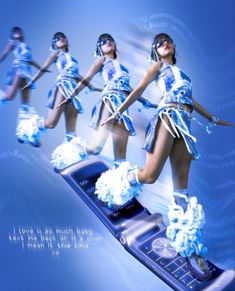 a cell phone with four girls dressed in cheerleader outfits on it's display