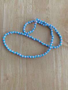 Blue and pink glass seed bead necklace . Blue Dangle Beaded Costume Jewelry Necklace, Blue Oval Beads Necklace With Beaded Chain, Blue Necklaces With Adjustable Oval Beads, Blue Oval Beads Necklaces For Jewelry Making, Blue Oval Beads Single Strand, Blue Single Strand Oval Beads, Blue Oval Beads Necklace For Gift, Blue Oval Single Strand Beads, Adjustable Blue Costume Jewelry Necklace