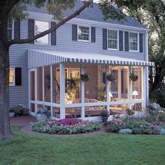 an advertisement for a screened porch with windows