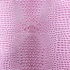 the texture of an alligator skin pattern in pink