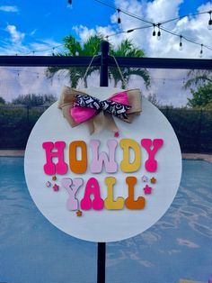 a sign that says hondy y'all hanging on the side of a fence