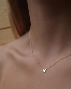 This dainty butterfly necklace is a classic and modern piece for the everyday, and is perfect for wear on its own or layered with your other Shop Emie pieces. Made with 10 karat solid gold, this necklace will last forever. Details: - Material: 10 karat gold - Dimensions: - Butterfly size: 6mm W x 5mm L - Available lengths: 15-18" EXPECTED SHIP DATE: 10 business days Have questions about this item? We're here to help. Send us an email. Women's Style Tips, Gold Pendant Designs, Minimalist Accessories Jewellery, Dainty Butterfly Necklace, Simplistic Jewelry, Mum Necklace, L Necklace, Gold Gallery, Dainty Butterfly