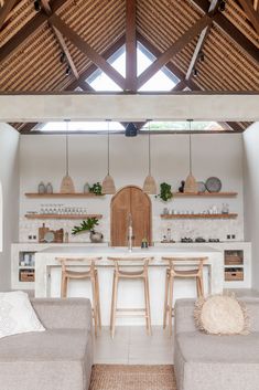 an open kitchen and living room area in a house