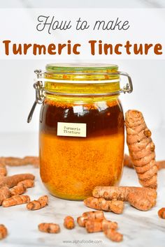 a jar filled with tumericic tincture sitting on top of a table