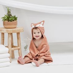 Baby will snuggle up for ultimate comfort after a bath and will love drying off with this warm, cozy baby bath wrap. The oh-so-cute hooded baby animal towel features an adorable, detailed face and tail. Made with 100% cotton velour terry for optimal quality & softness and is the ultimate luxury baby gift. 100% cotton velour terry Loop on back of hood for easy hanging Fits 0-24M Measures 23” x 31” Bath time essential for baby registry or baby shower gift Machine wash cold, tumble dry low Look Luxury Baby Gifts, Baby Bath Towel, Bath Wrap, Hooded Bath Towels, Hooded Baby Towel, Baby Lamb, Baby Unicorn, Elegant Baby, Luxury Baby