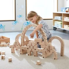 Take block building out of the box and bend the creativity with this amazing and innovative Interlocking Wooden Blocks Construction Set, Children can build arches, curves, and so much more with this innovative solid wood block set. This cleverly designed wooden block set uses a tongue and groove system to provide the necessary stability for structures to bend the rules of traditional block building. The set comes with 117 durable and stable wooden pieces of varying lengths and dimensions. Made i Building Blocks Shelf, Wood City Toys, Store Blocks, 12 Month Toys, Baby Hanging Toys, Wooden Marble Run, Sorting & Stacking Toys, Interlocking Blocks, Block Building