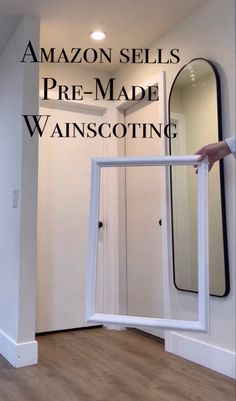 a person is holding an open door in front of a mirror with the words amazon sells pre - made wannscotting on it